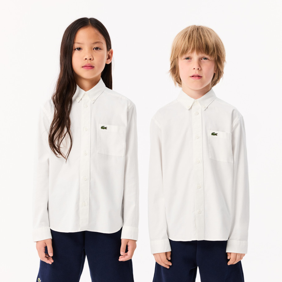 Chemise enfant Lacoste avec poches contrastées sur le devant