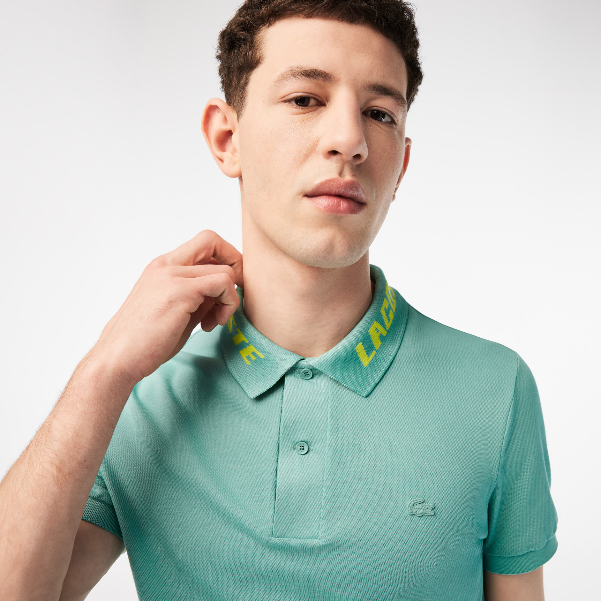 Polo homme slim fit en piqué stretch avec marquage Lacoste